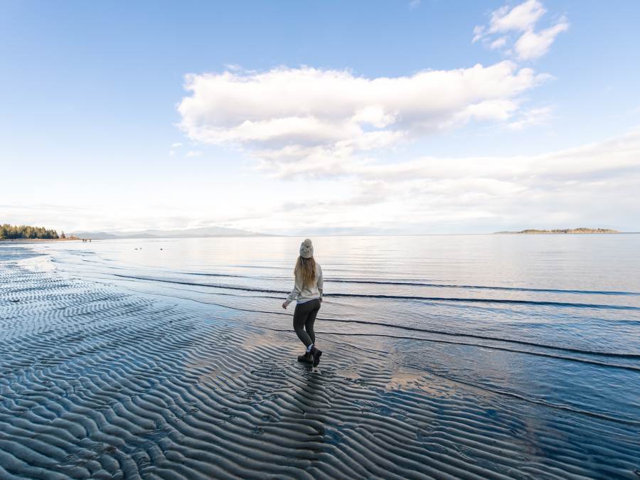 girl walking on Rathtrevor Beach