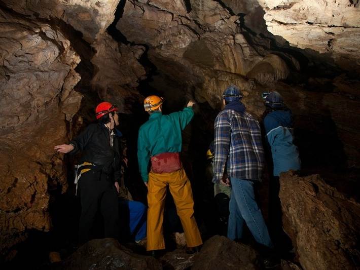A group touring Horne Lake Caves on Vancouver Island.