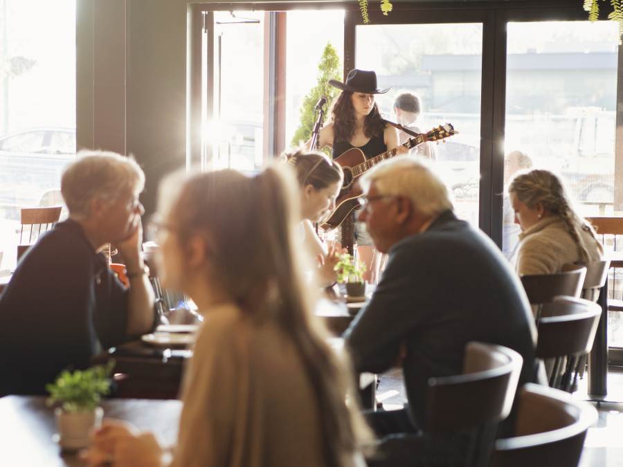A performer singing at a restaurant in Parksville Qualicum Beach, Vancouver Island.