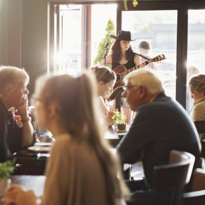 A performer singing at a restaurant in Parksville Qualicum Beach, Vancouver Island.