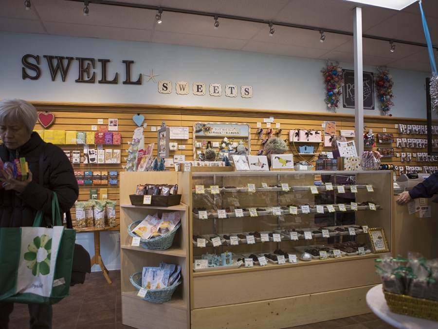 Interior of the Swell Sweets candy shop in Parksville Qualicum Beach with shelves filled with candy