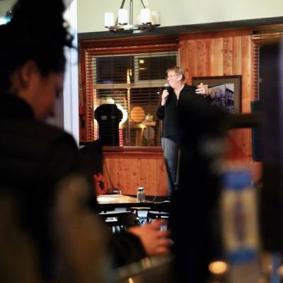 A performer entertains the patrons of Rod and Gun