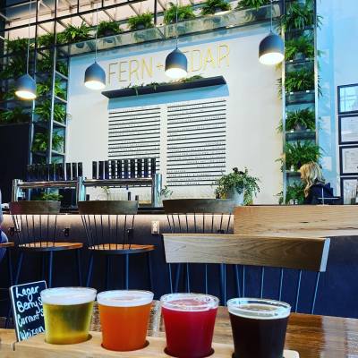 A flight of four craft beers at Fern + Cedar Brewing. Image: @bcaletrailadventures