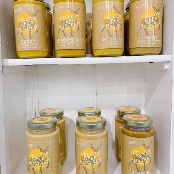 Jars of Yellow Deer Mustard on a shelf on Vancouver Island, BC. Image: @musselsandmorepottery