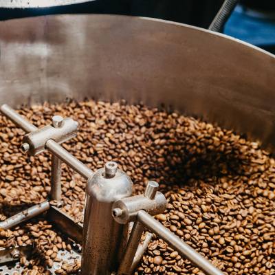 Coffee beans in a roasting machine. Photo Credit: French Press Coffee Roasters