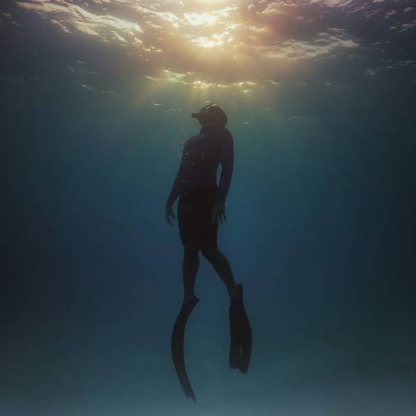 scuba diver ascending to top of water in Parksville Qualicum Beach BC Canada