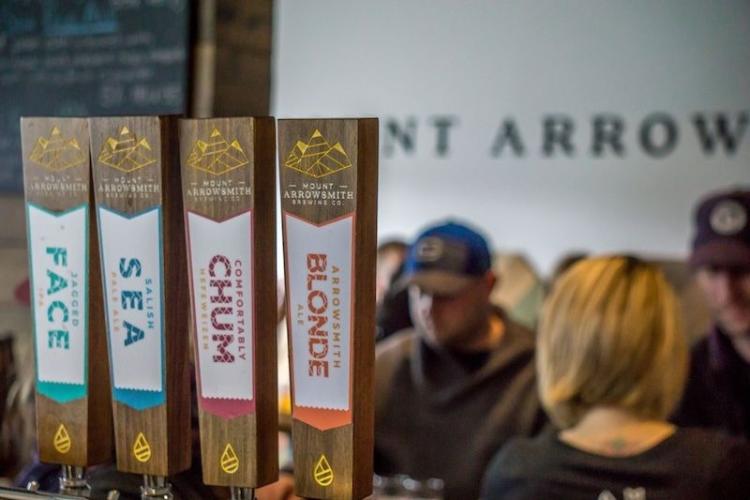 close-up of four beer taps featuring four different craft beers at Mount Arrowsmith Brewing, a popular Parksville brewery
