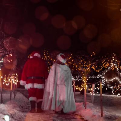 Santa and Mrs Clause walking through Milner Gardens during their christmas holiday lights event in Parksville Qualicum Beach