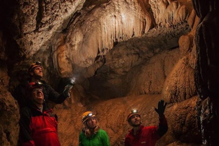 Group exploring Horne Lake Caves in Qualicum Beach on Vancouver Island